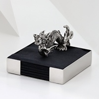 The grand form of a mythical dragon was the muse behind this sculptural, hand-cast napkin holder from Natori.