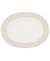 Dressed in a fine diamond grid of bronze and warm taupe, this oval platter is tailored for formal dining and everyday elegance in Noritake bone china. A handsome host for holiday meals or anytime feasts. From Noritake's collection of serveware and serving dishes.