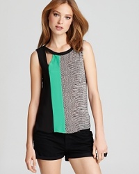 A patchwork of print and color emboldens this BCBGMAXAZRIA tank, complete with a cutout detail at the neckline for an extra modern touch.