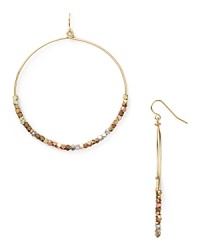 Work this season's exotic influences into your accessories collection with this pair of beaded hoop earrings from Vanessa Mooney, accented by an eclectic mix of metallic beads.