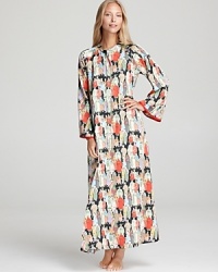 Take a trip across the globe in Natori's Eastern-inspired caftan with a Mandarin collar and half-zip front.