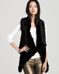 Layer up in the luxe fur of this Alice + Olivia vest. An open silhouette and cascading front adds instant glam.