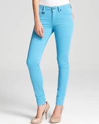 A bright outlook on the season ahead, these Burberry Brit jeans lighten your everyday look with a well-worn silhouette in a washed turquoise. Amp up the skinny silhouette with sleek pumps.