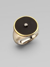 From the Nile Collection. A dramatic disc of black onyx is centered with one sparkling white topaz, framed in gleaming goldplate and set atop a brushed sterling silver band.Black onyx and white topazSterling silverGoldplatedDiameter, about ¾Imported