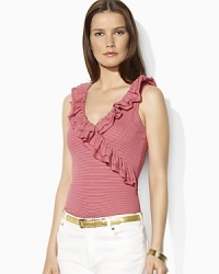 A flourish of ruffles along the neckline lends feminine appeal to a faux-wrap sleeveless top in soft cotton jersey.