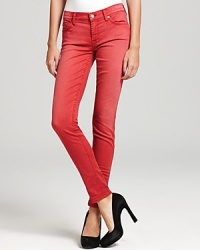 Subtle fading creates a cool sun-bleached effect on these vibrantly hued 7 For All Mankind skinny jeans.