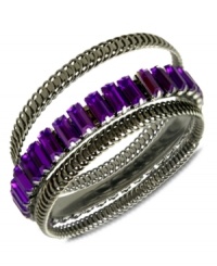 A splash of color changes everything. This set of 3 bangle bracelets from GUESS highlight textured designs and one with amethyst-colored glass baguettes. Crafted in hematite tone mixed metal. Approximate diameter: 2-3/4 inches.