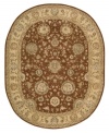 Bring new life to any room of your home. This gorgeous rug, sprouting intricate designs of vinery and blossoming flowers, opens up any space with warm tones of burnt red and beige. With an all-wool construction, accented with rich silk highlights, this stylish Nourison 2000 import is ultra-durable and luxuriously soft to the touch.