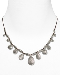 Lauren Ralph Lauren pays homage to Southwestern style with this drop necklace, accented by an evocative mix of natural cord and textured silver-plated beads.