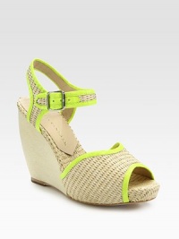 Textured raffia wedge design with an adjustable ankle strap and smooth, contrasting leather trim. Covered wedge, 4 (100mm)Self-covered platform, 1 (25mm)Compares to a 3 heel (75mm)Raffia and leather upperLeather lining and solePadded insoleImportedOUR FIT MODEL RECOMMENDS ordering true size. 