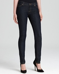 Gleaming silver signature accents enhance the dark wash of these MICHAEL Michael Kors jeans, cut in a slim silhouette for an all-around on-trend look.