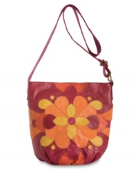 Get your groove on with this retro crossbody from Lucky Brand that'll give any look a lift. Plush leather patchwork in a kaleidoscope of color and geometric, floral pattern is altogether eye-catching, while strategically placed pockets make access to essentials a breeze.