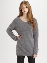 Ultra-cozy fine angora blend with an elongated hemline for superior comfort. ScoopneckDropped shouldersLong dolman sleevesRibbed trim at the neckline, cuffs and hemAbout 22 from shoulder to hem70% angora/30% nylonDry cleanImportedModel shown is 5'10 (177cm) wearing US size Small.