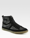 Sporty design with an edgy, downtown attitude in tonal leather and suede.Leather liningPadded insoleRubber soleImported