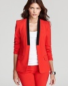 Embrace modern design as clean lines and block colors combine for a sleek VINCE CAMUTO blazer. Style with skinny pants for a chic, structured silhouette.