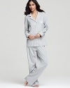 A classic pajama set that you'll be tempted to show off outside the bedroom, featuring ornate logo and contrast trim.