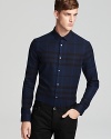 A sleek fit and signature check pattern lend statement style to this Burberry London shirt.