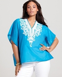 Lend a touch of boho-chic to your daily repertoire with this Karen Kane Plus top touting glistening metallic embroidery.