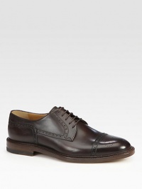 Leather lace-up derby with cap-toe and brogue detailing.Leather soleMade in Italy