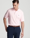 A classic pique polo features signature whale embroidery. From Vineyard Vines.