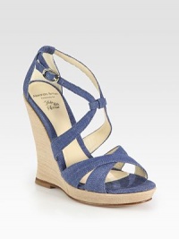 Delectable denim with a dainty, adjustable ankle strap and stacked wooden wedge. Stacked wooden wedge, 5 (125mm)Covered platform, ¾ (20mm)Compares to a 4¼ heel (110mm)Denim upperLeather liningBuffed leather solePadded insoleImportedOUR FIT MODEL RECOMMENDS ordering true size. 