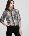 Perfectly on trend with a chic snakeskin print, this silky and sheer Vintage Havana shirt looks great with jeans--layer on a cami and make a statement this season.