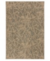 An intricate depiction of wildflower silhouettes are placed over a modern abstract motif in the Carmel Salinas area rug from Karastan, offering a soft yet fashionable accent for any room. Thick and resilient underfoot, this plush piece is woven from 2-ply nylon pile, ensuring easy care and long-lasting wear.