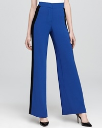 A high waist and wide leg lend sophistication to these Trina Turk pants, fashioned in statement-making blocked colors.