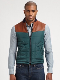 Casual vest adds a layer of warmth and style in this modern combo of leather and nylon.Front zipperSide pocketsLeather shouldersAbout 24 from shoulder to hemPolyamide/polyesterDry clean by leather specialistMade in Italy