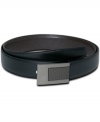 Add a modern edge to your look with this etched plaque reversible belt from Tumi.