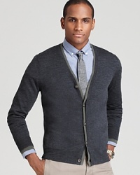 A double layer at the placket provides contrast, giving this handsome and thoroughly soft merino wool cardigan an extra dose of personality.