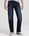 Suave straight leg jeans by Diesel in a robust dark wash, offset by bright orange stitching.