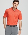 A diagonal windowpane design embellishes this bright polo with an elevated vibe.