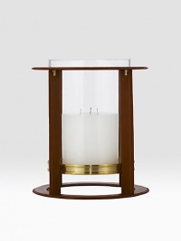 Crafted from gleaming glass, and encased in a supple saddle leather frame to evoke a heritage panache.12 L x 14¼ H6 X 6 candle recommendedLeather, glass and brassImported