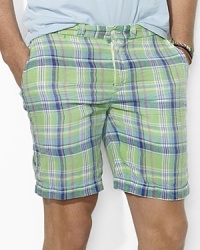 A versatile essential for every warm-weather wardrobe, a soft cotton chino short features one solid side and one madras side for a timeless, preppy look.