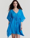 A vibrant and flowy caftan with a V-neckline and drawstring waist, a chic bedtime look from Midnight by Carole Hochman.