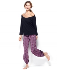 Comfortable cuteness is all yours. Material Girl's sweatshirt has a large round neck and lace inserts at the sides while the baggy lounge pants feature an all-over Aztec patten.