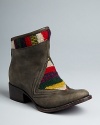 Get into Southwestern style in these low-key FREEBIRD by Steven booties. Mixed-media blanket-patterned textile and leather uppers give them a distinctive look among the Western set.