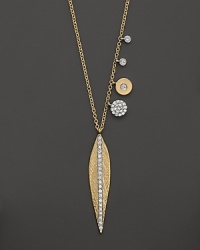 A diamond-embellished leaf pendant necklace in yellow gold from Meira T.