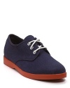 A preppy classic in hopsack canvas, the McNairy shoe is accented with leather overlays and a contrast rubber sole.