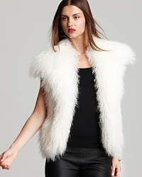 Send your style on an exotic quest in a statement MICHAEL Michael Kors vest enlivened by plush Tibetan lamb fur.