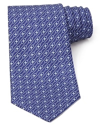 Signature Gancini logos are banded by stripes for an alluring pattern on this handsome Salvatore Ferragamo silk tie.