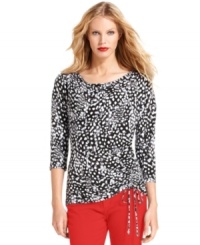 MICHAEL Michael Kors' new top features a rich print and stylish details, like a ruched side and drawstring detail at the hem.