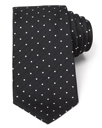 A brilliant design, from the strikingly rich color to the ingenious and unique craftsmanship of Turnbull & Asser, this classic tie features a polka dot pattern with a herringbone ground for a dynamic accent to your dress shirting.