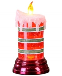 Set the mood. Give your house a festive glow this holiday season with the red and green striped LED candle from Napco. Glitter accents give it even more sparkle.