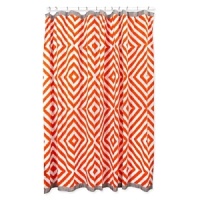 A vibrant orange stripe pattern bordered with grey grosgrain trim enlivens any modern bath décor.