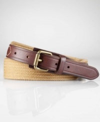 Supple leather tabs and an antiqued metal roller buckle lend relaxed refinement to a cotton web belt.