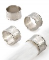 Perfectly rough around the edges, Handmade napkin rings feature an organic hammered design with softly ruffled rims. A brilliant silver shine dresses up any table linens.