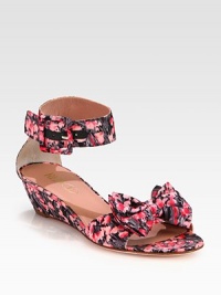 A blooming floral print freshens this nylon design with a wide ankle strap and pleated bow adornment. Self-covered wedge, 1¾ (45mm)Nylon upperAdjustable ankle strapLeather lining and solePadded insoleMade in Italy