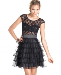 Roberta's update to the classic little black dress adds edge and flair with a chic lace top and sultry bustier! Chic ruffles at the skirt complete its hot look!